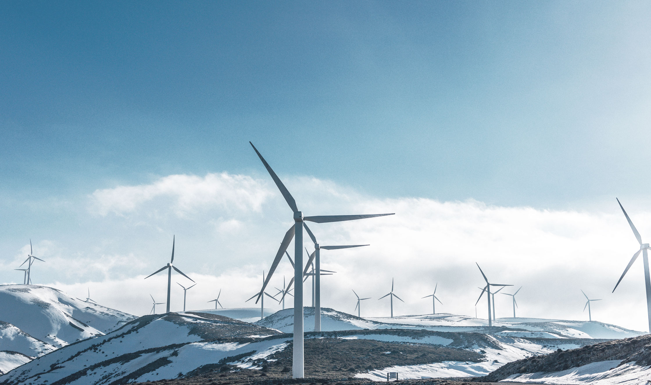 Wind power plants on snowy mountains